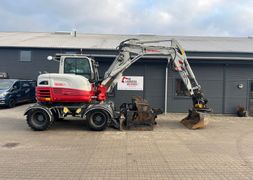 Takeuchi TB295W Aftageligt Engcon Centralsmrring og skovlpakke