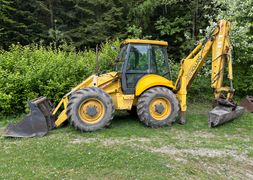 New Holland LB115B4PS SS med flytbar grave plasering